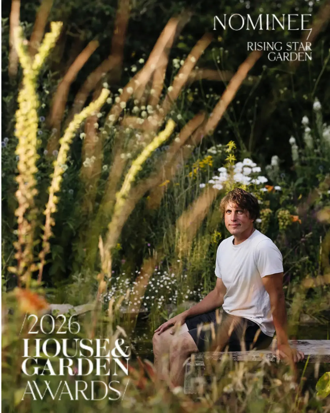 Will Tomson seated by a wildlife pond among tall verbascum and meadow planting — House & Garden Awards 2026 Rising Star Garden nominee